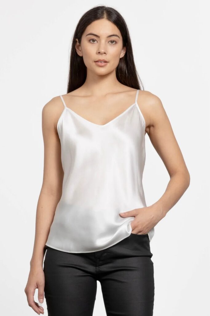 A woman wearing a silk camisole